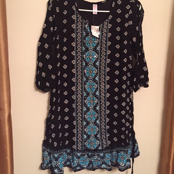 NWT justice dress with tie back strings.