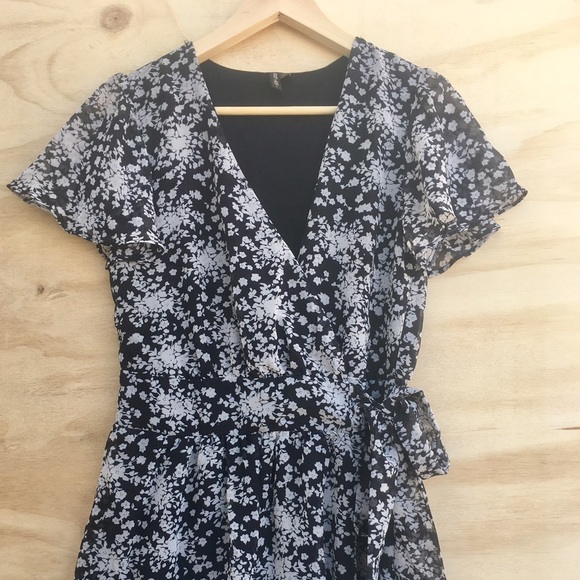Floral ruffled black and white play suit romper