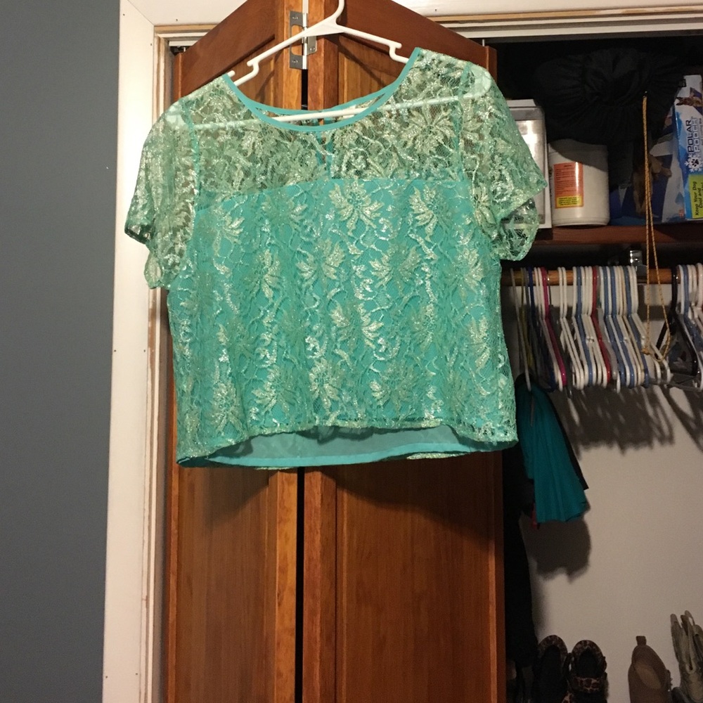 Teal short sleeve crop top.