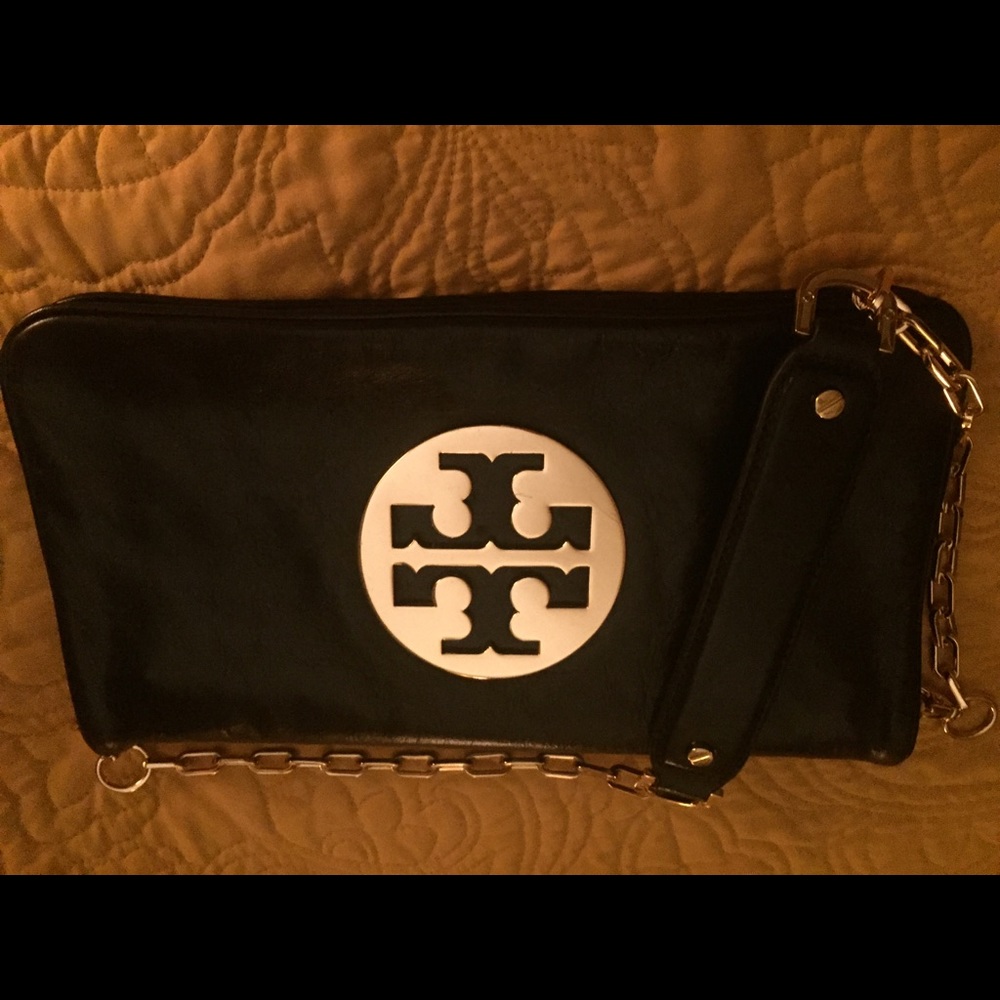 Tory black leather with gold.  Great condition