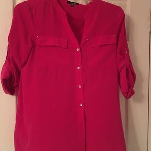 Fuchsia colored v-neck button down blouse