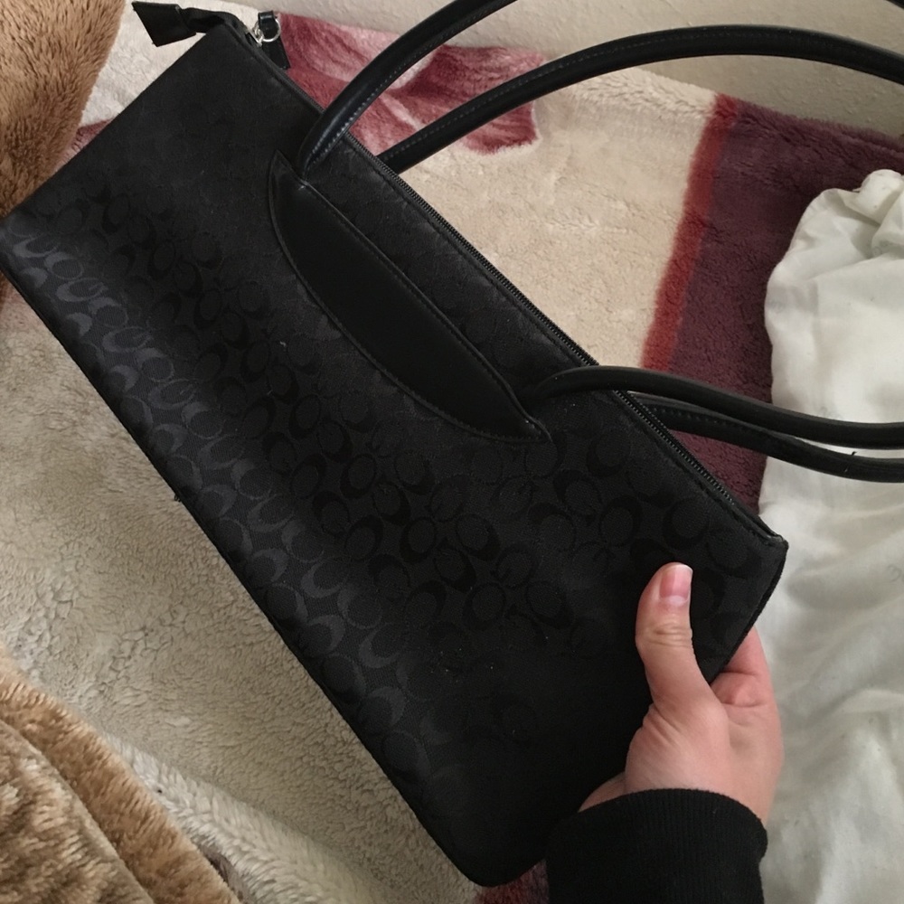 Black coach purse with two pockets