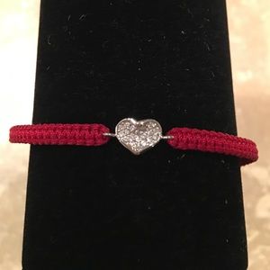 TAI Silver stone heart on red macramé bracelet.