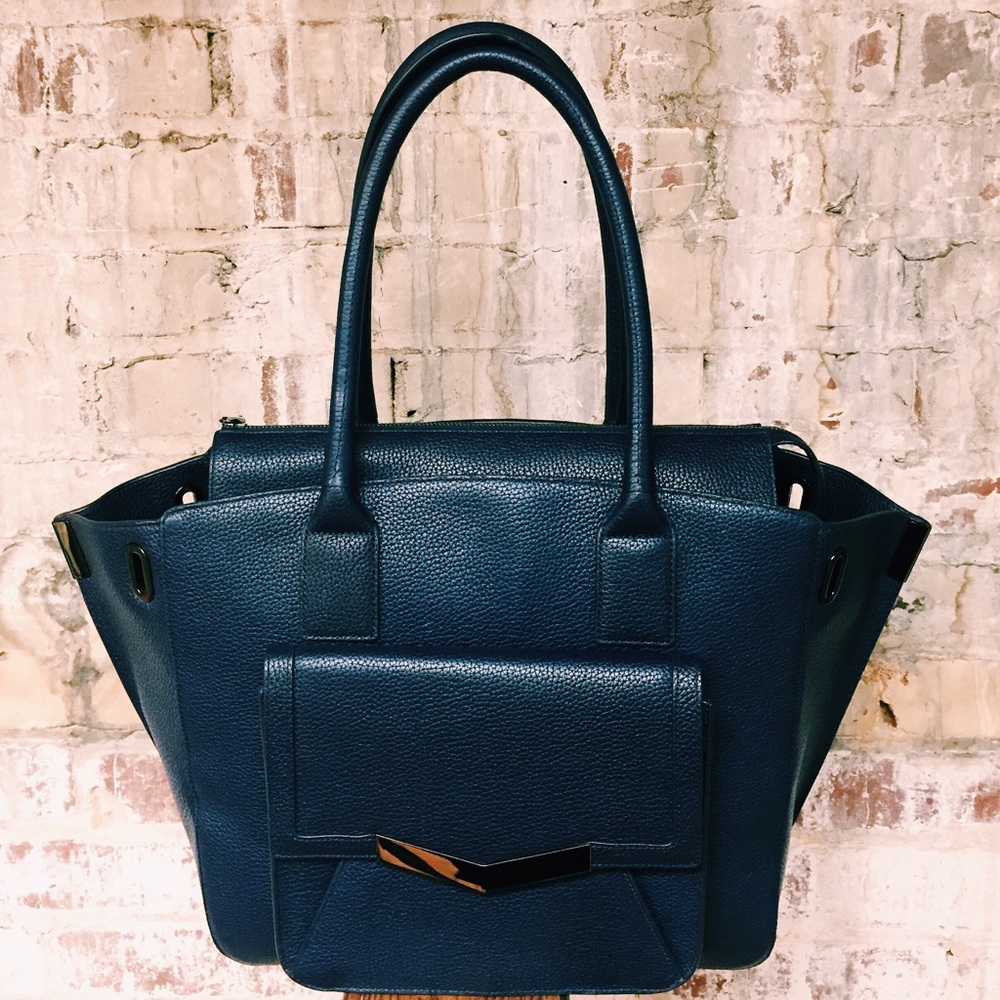 Time's Arrow authentic dark blue leather purse