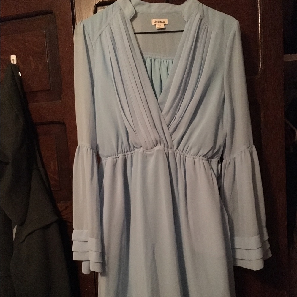 Light blue shirt.