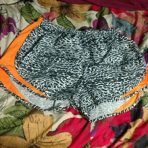 Zebra and orange Nike Tempo shorts
