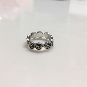 Silver boho swirl band ring.