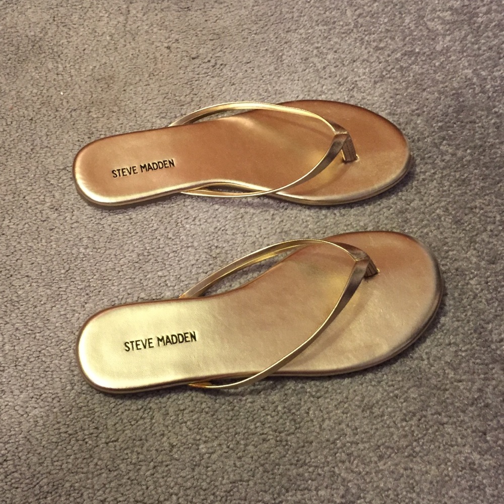 Steve Madden gold flip flops