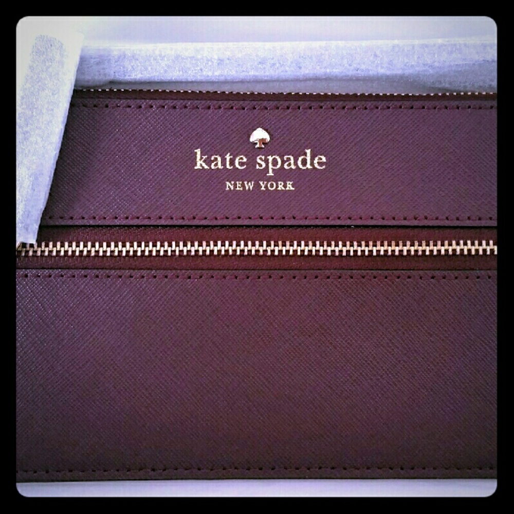 Kate Spade's Mikas Pond Bee Wristlet in Mulledwine