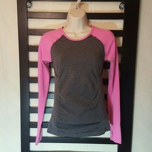 small pink and grey shirt with thumb holes