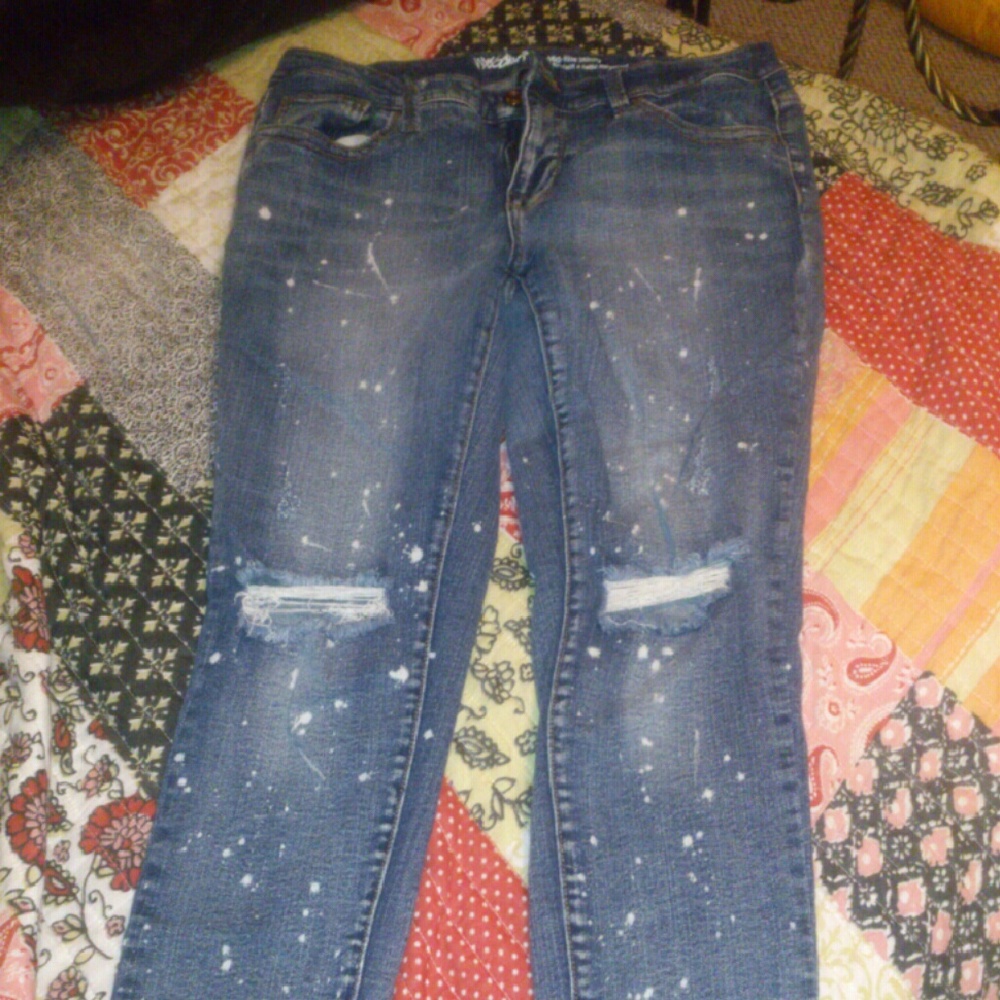 Skinny washed out holey jeans