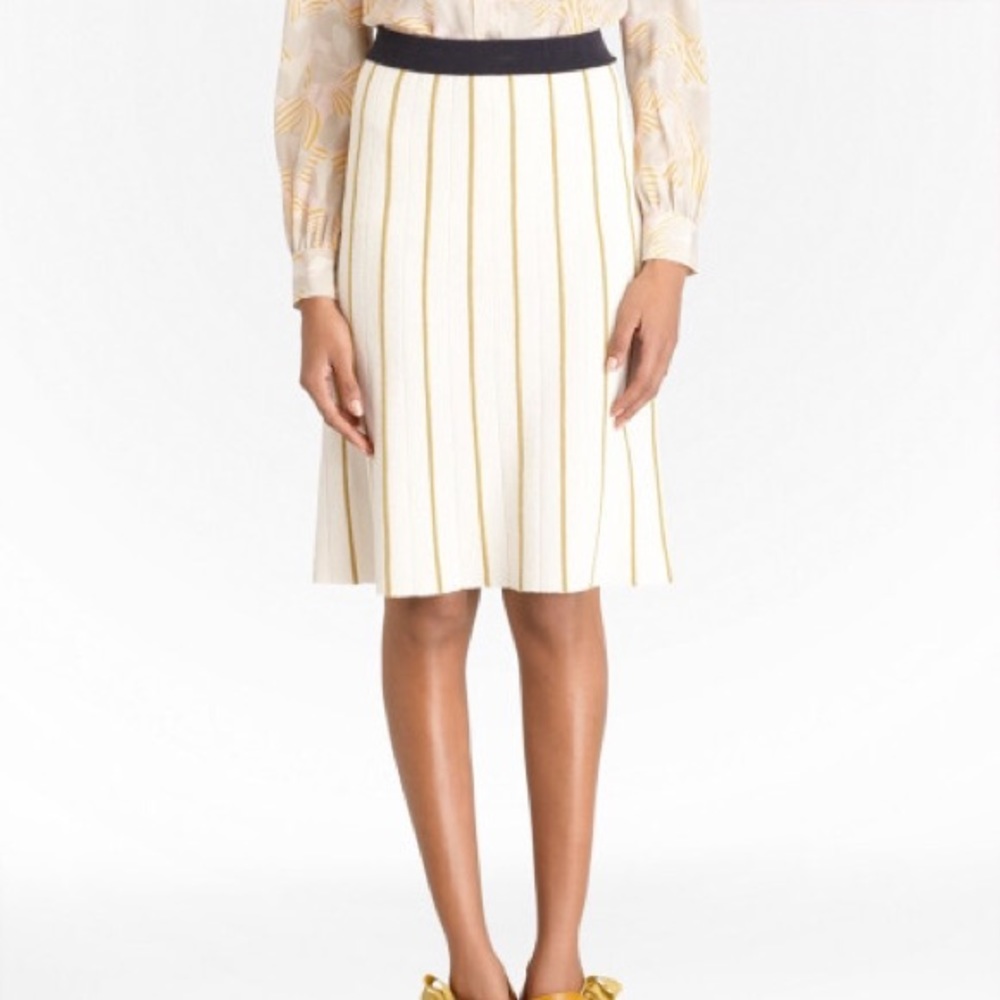 A lined sweater skirt. Banded waist. Knee length.