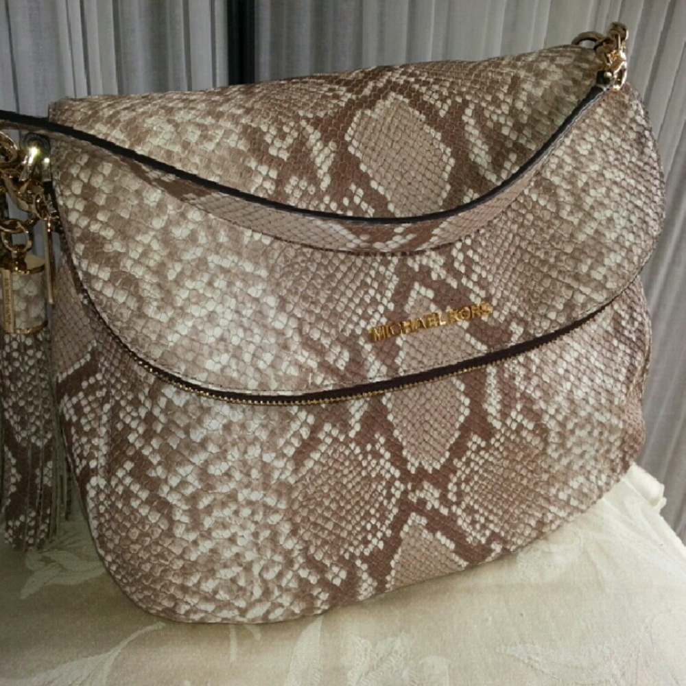MK, Lrg. Tassel Convertible Crossbody  60% OFF