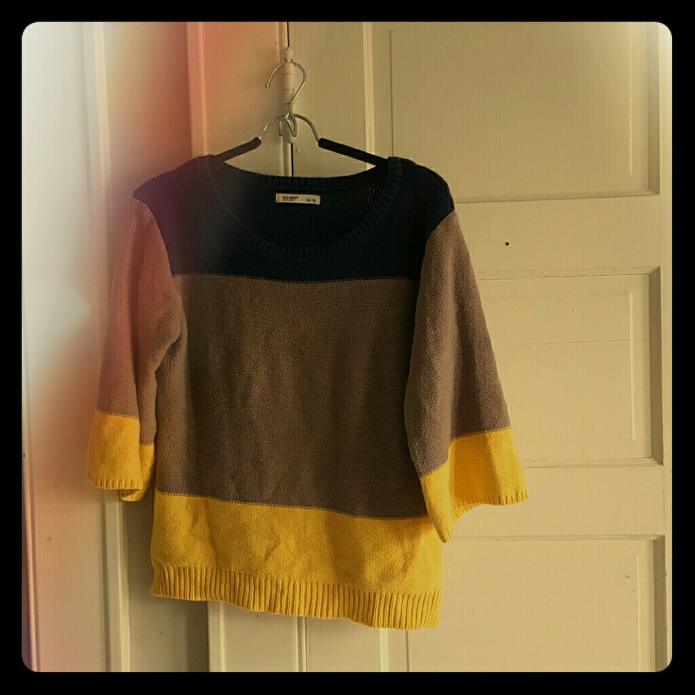 A cropped wide sleeve sweater