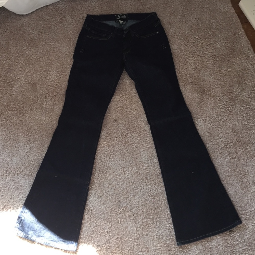 Dark wash Lucky Jeans.