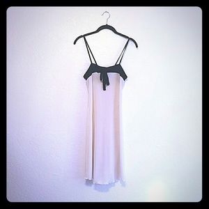 White silk halter dress with black bow