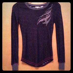 Flashy striped top with sequin appliqués!