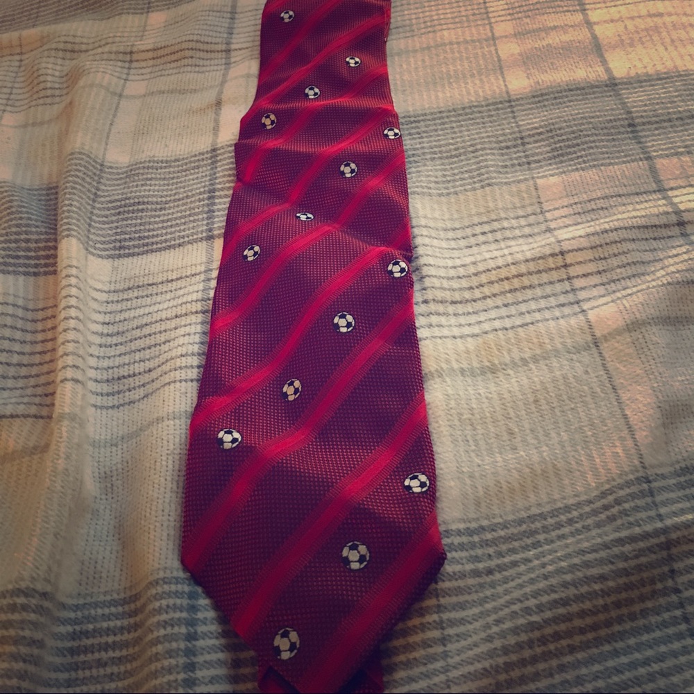 Red Arivri neck tie with soccer balls.