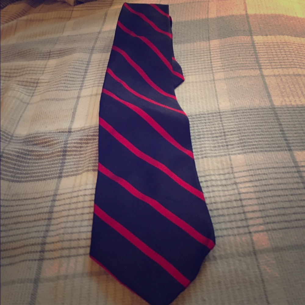 Navy blue and red striped neck tie