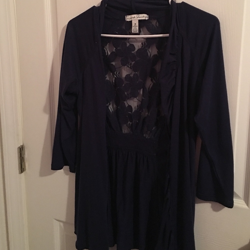 Dressy over shirt with lace back. Never worn.