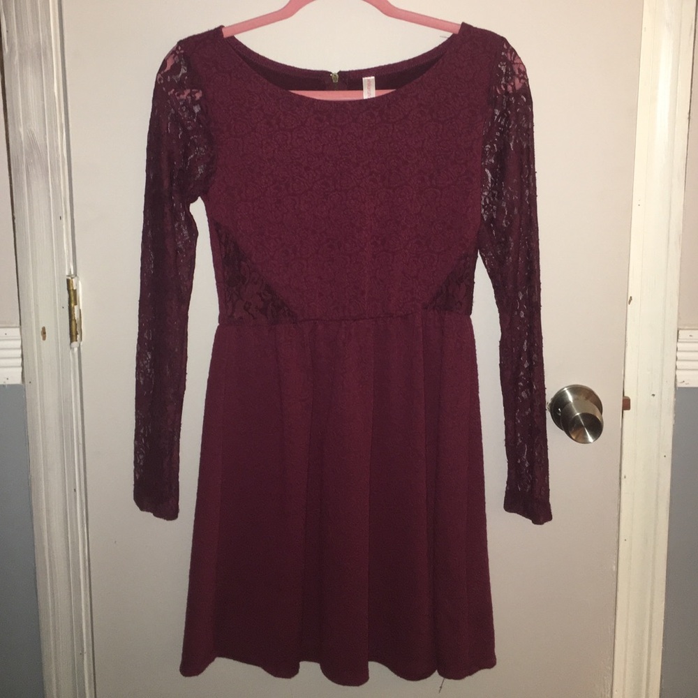 Burgundy cocktail dress with sheer details.