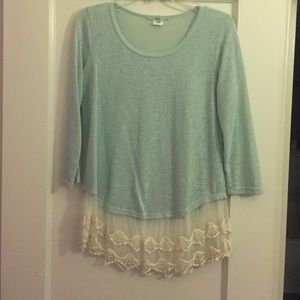Pale blue top with lace skirt.