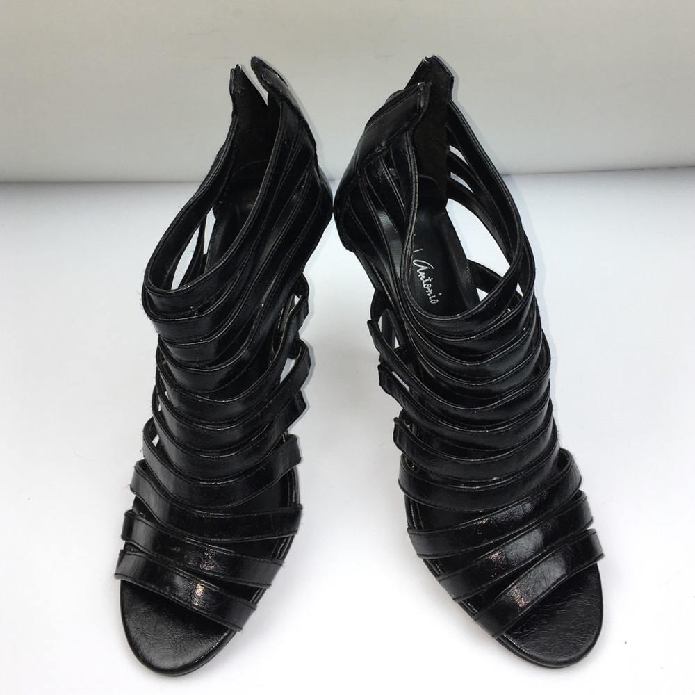 Black strapy patent stilettos.