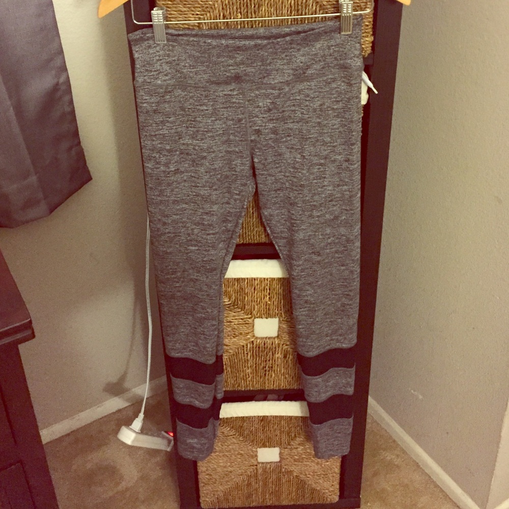 Grey/black leggings. Sheer stripes on bottom