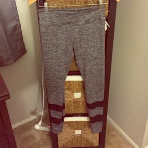 Grey/black leggings. Sheer stripes on bottom