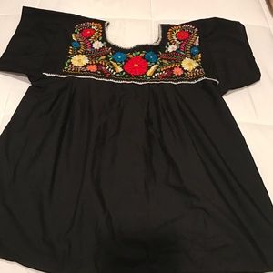 Embroidered babydoll shirt.