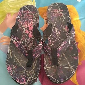 Muddy girl flip flops