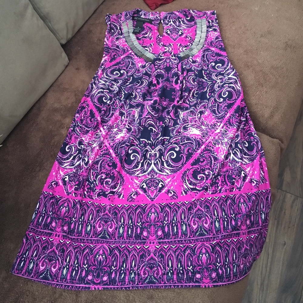 Purchased, removed tags, never worn.  Runs small.