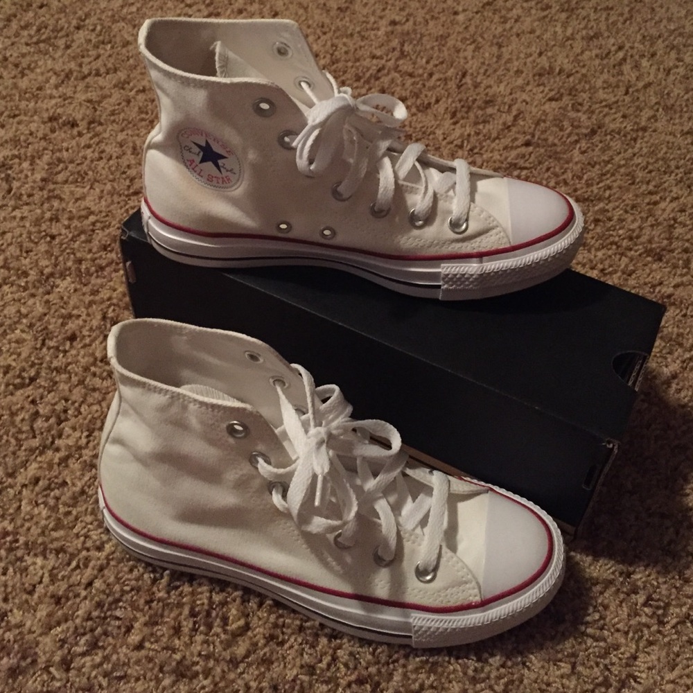 White, high top converse.