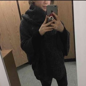 Cozy and warm knitted sweater poncho