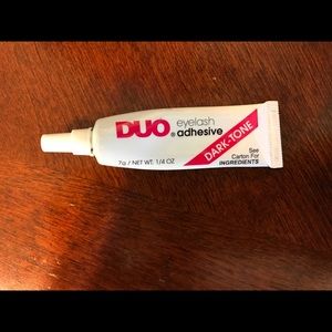 DUO eyelash glue in the color black.