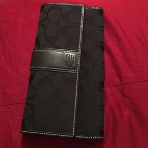 Black trifold Coach wallet
