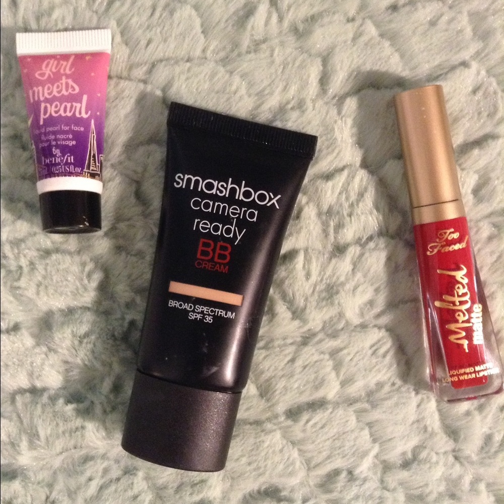 A highlighter, a BB cream, and a liquid lipstick