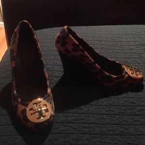 Tory Burch leopard wedges with gold T on front.