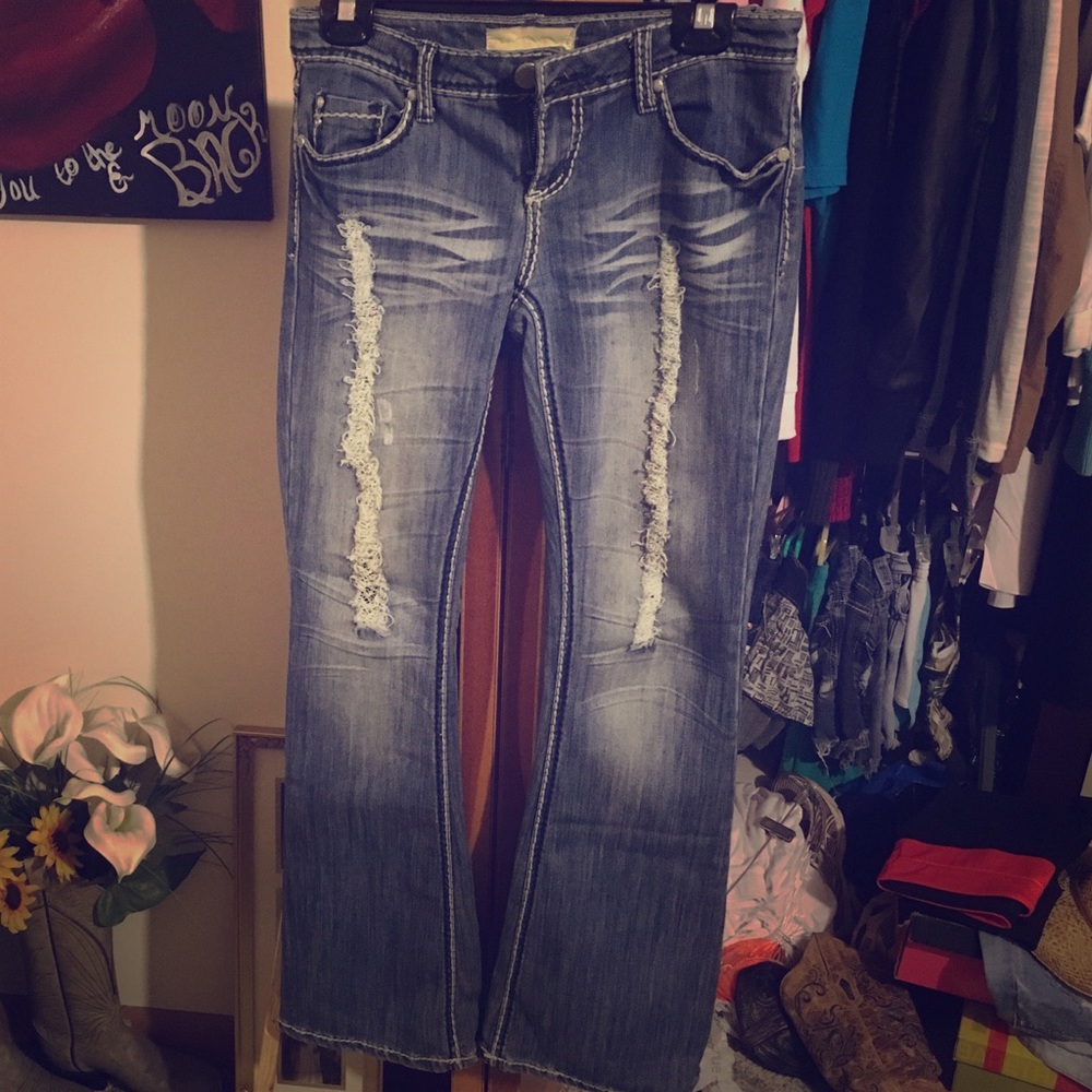 Distressed blue jeans.