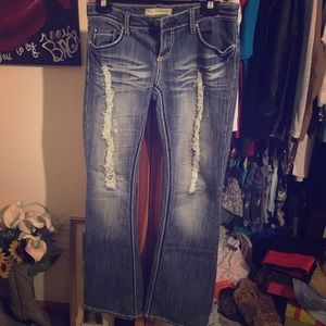 Distressed blue jeans.