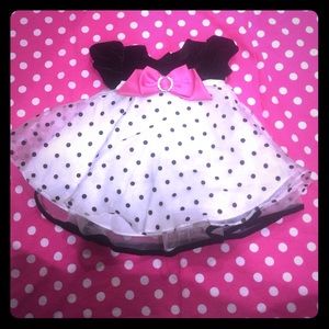 Velvet and crinoline dress with bow.