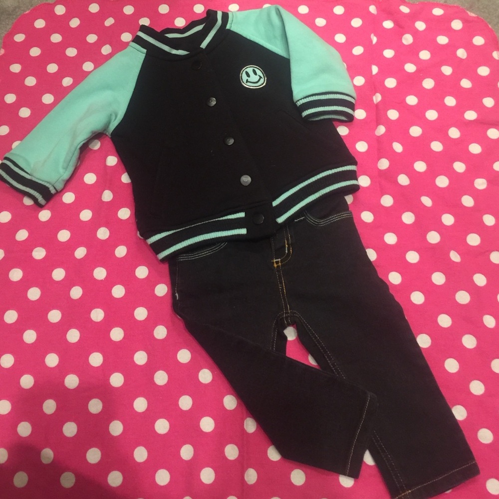 Black and mint green letterman jacket and jeans.