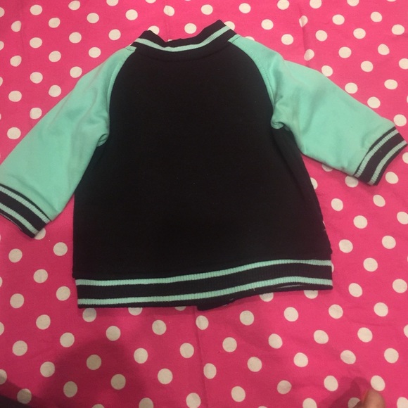 Black and mint green letterman jacket and jeans. - Picture 4 of 4