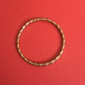 A thick gold bracelet