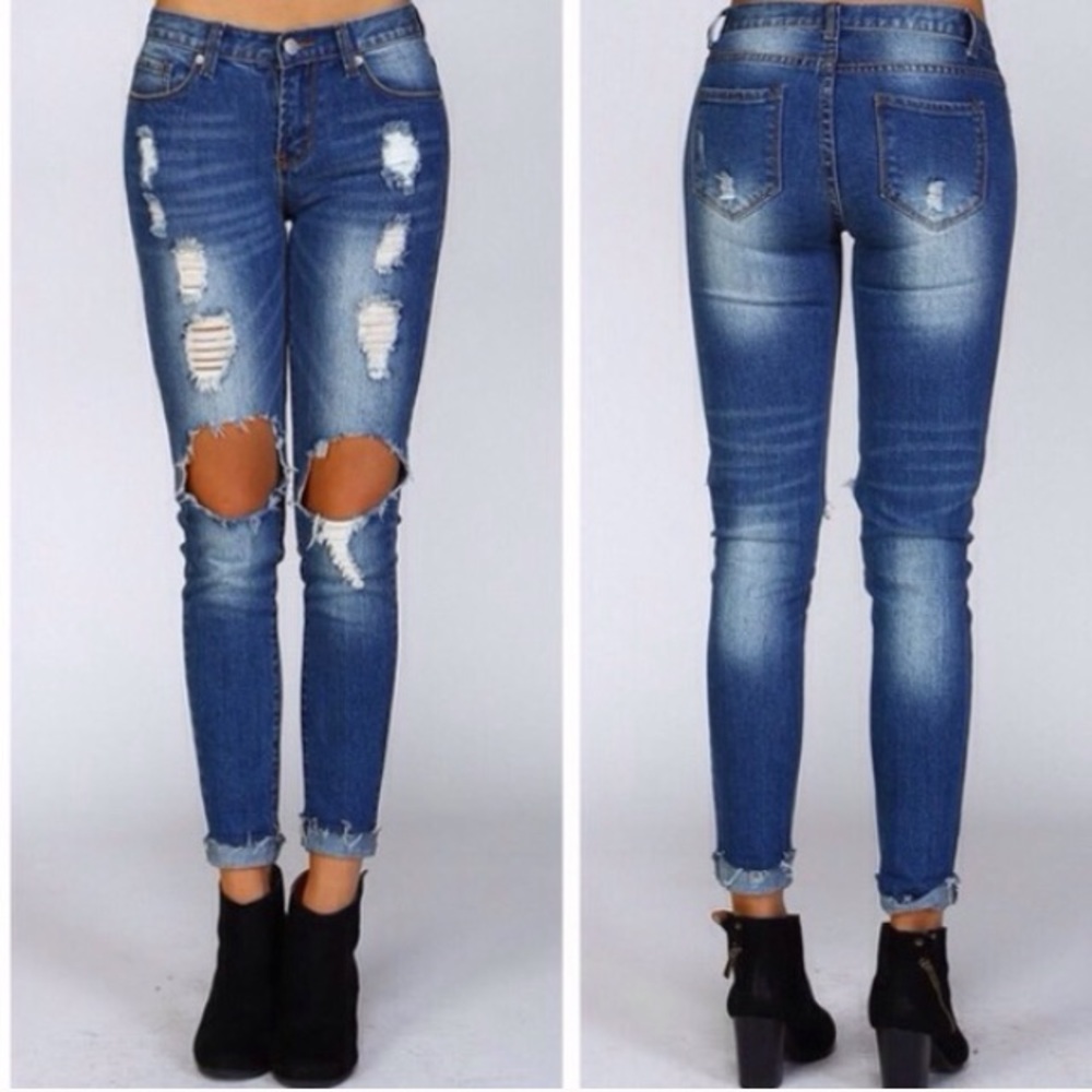 Ripped torn destroyed distressed dark wash jeans
