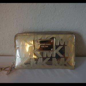Gold Michael Kors Wrist wallet/ wristlet