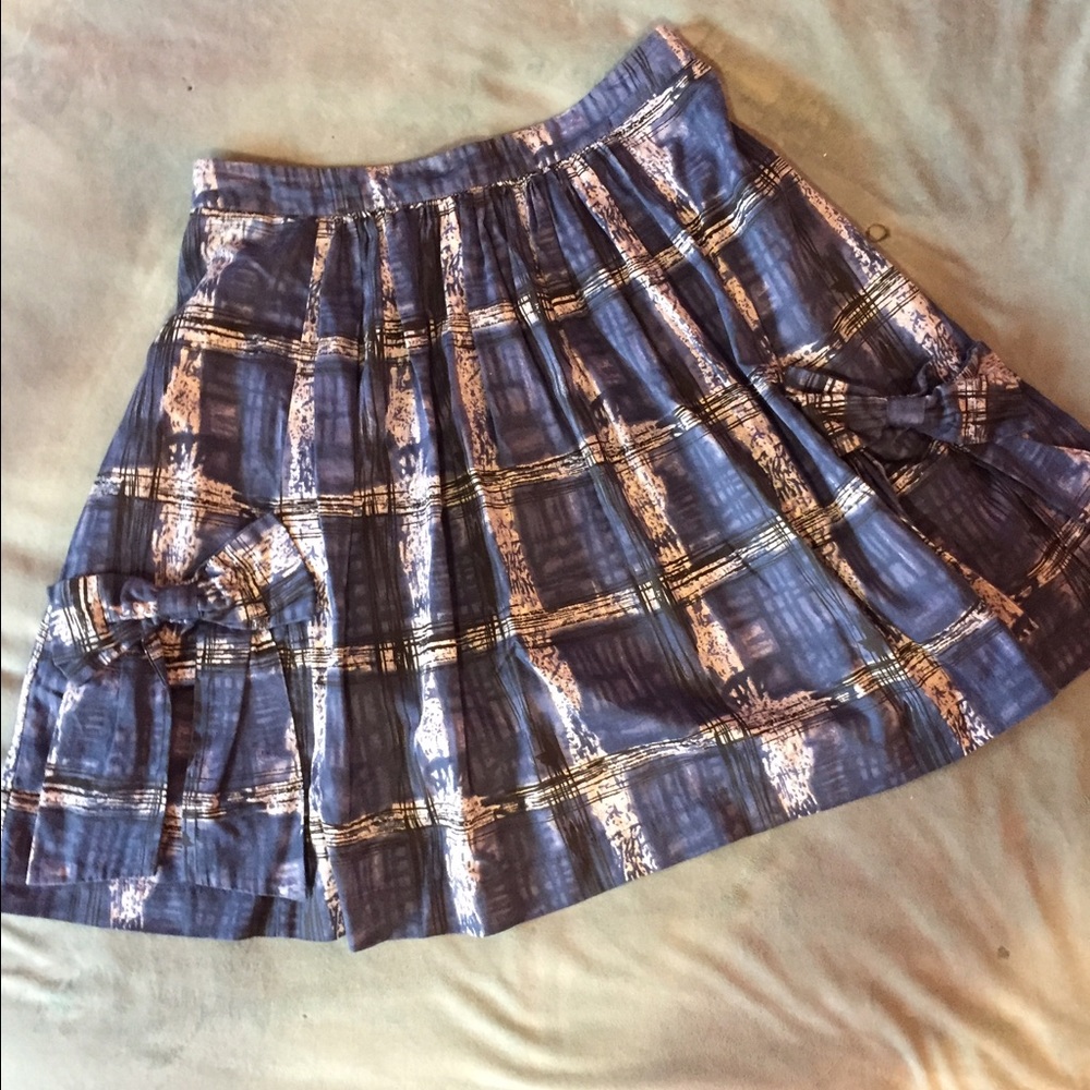 Sweet Anthropologie flare skirt with bow pockets