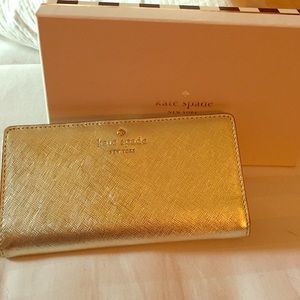 Brand new Kate Spade crosshatched leather wallet.