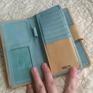 Fossil nude and aqua wallet.