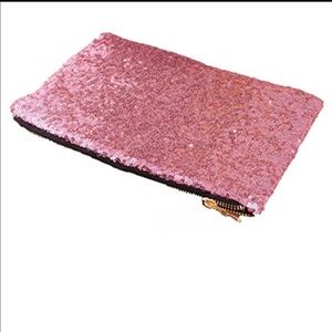 Pink sequin clutch, leopard print inside